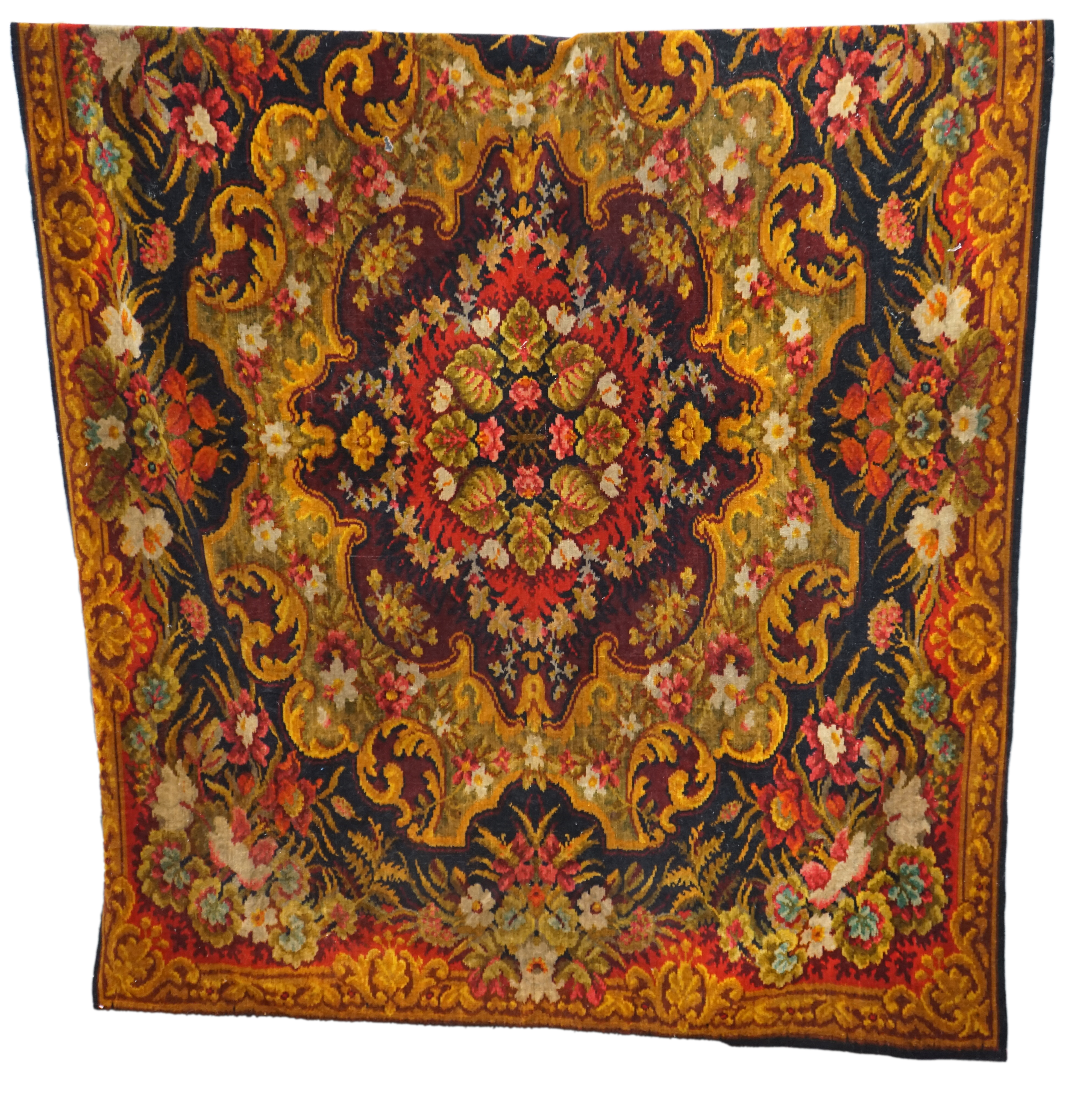 An Edwardian table cover in brightly coloured wools, with a floral design, together with a later 20th century continental grey, beige and cream patterned silk cover, Edwardian table cover 220cm x 172cm. Condition - colou